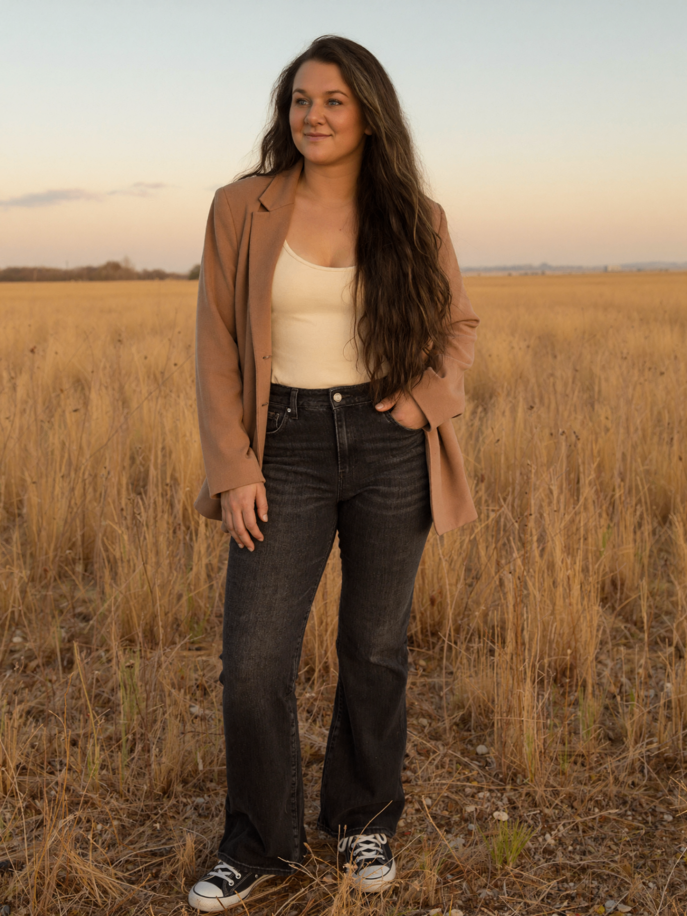 Boss Suite founder in a wheat field at golden hour
